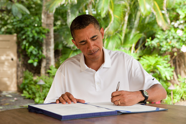 President Barack Obama signs H.R. 847, the "James Zadroga 9/11 Health and Compensation Act" in Kailua, Hawaii, Jan. 2, 2011. (Official White House Photo by Pete Souza)