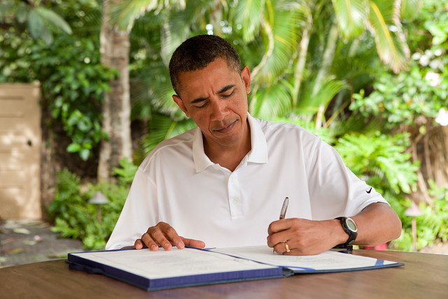 President Barack Obama signs H.R. 847, the "James Zadroga 9/11 Health and Compensation Act" in Kailua, Hawaii, Jan. 2, 2011. (Official White House Photo by Pete Souza)