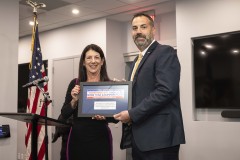 Ryan Delgado receives award.