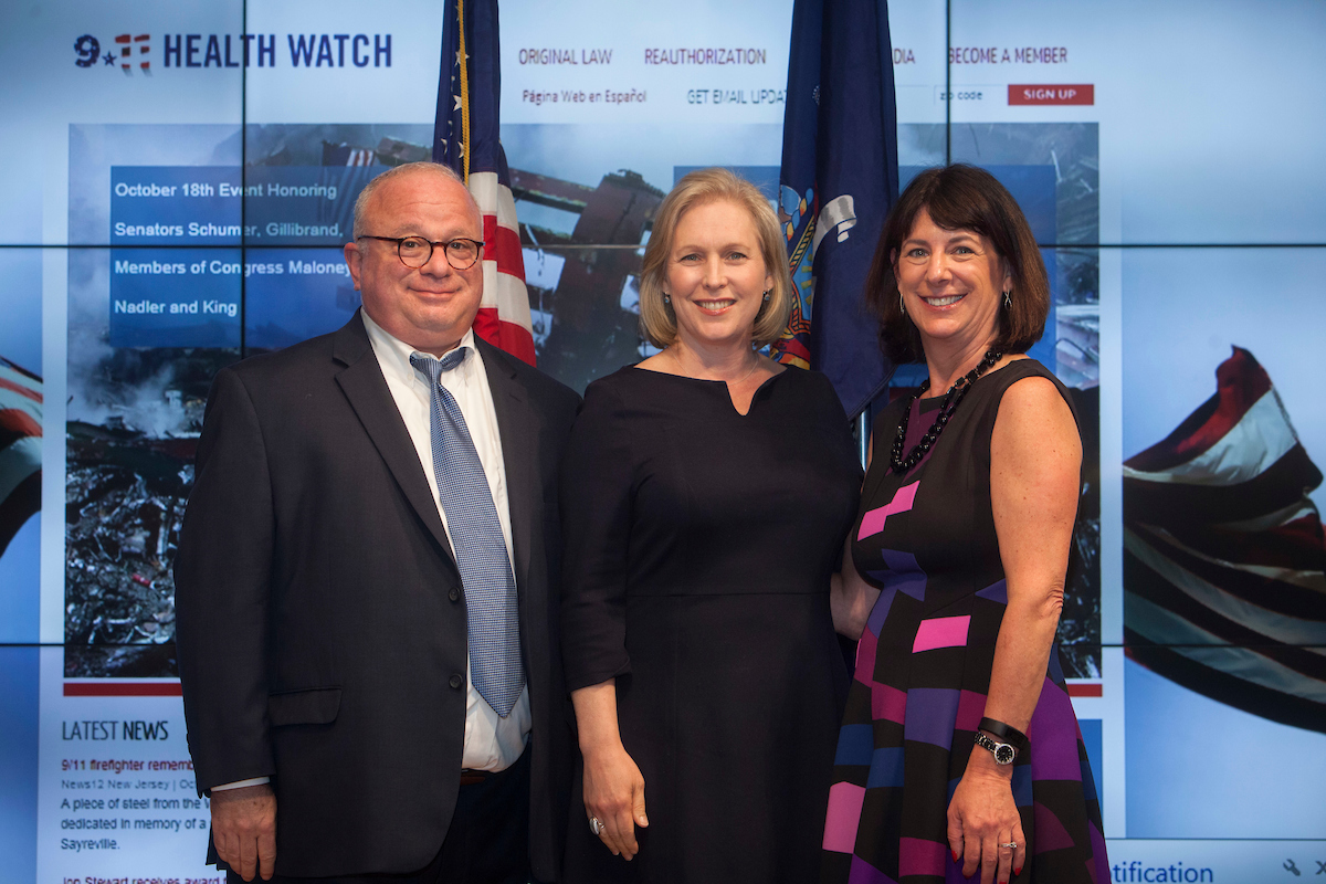Senator Gillibrand and 911 Health Watch Executive Director Benjamin Chevat and Board Member Suzy Ballantyne